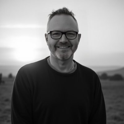 Matthew Ruttan, silhouetted against a sunrise sky